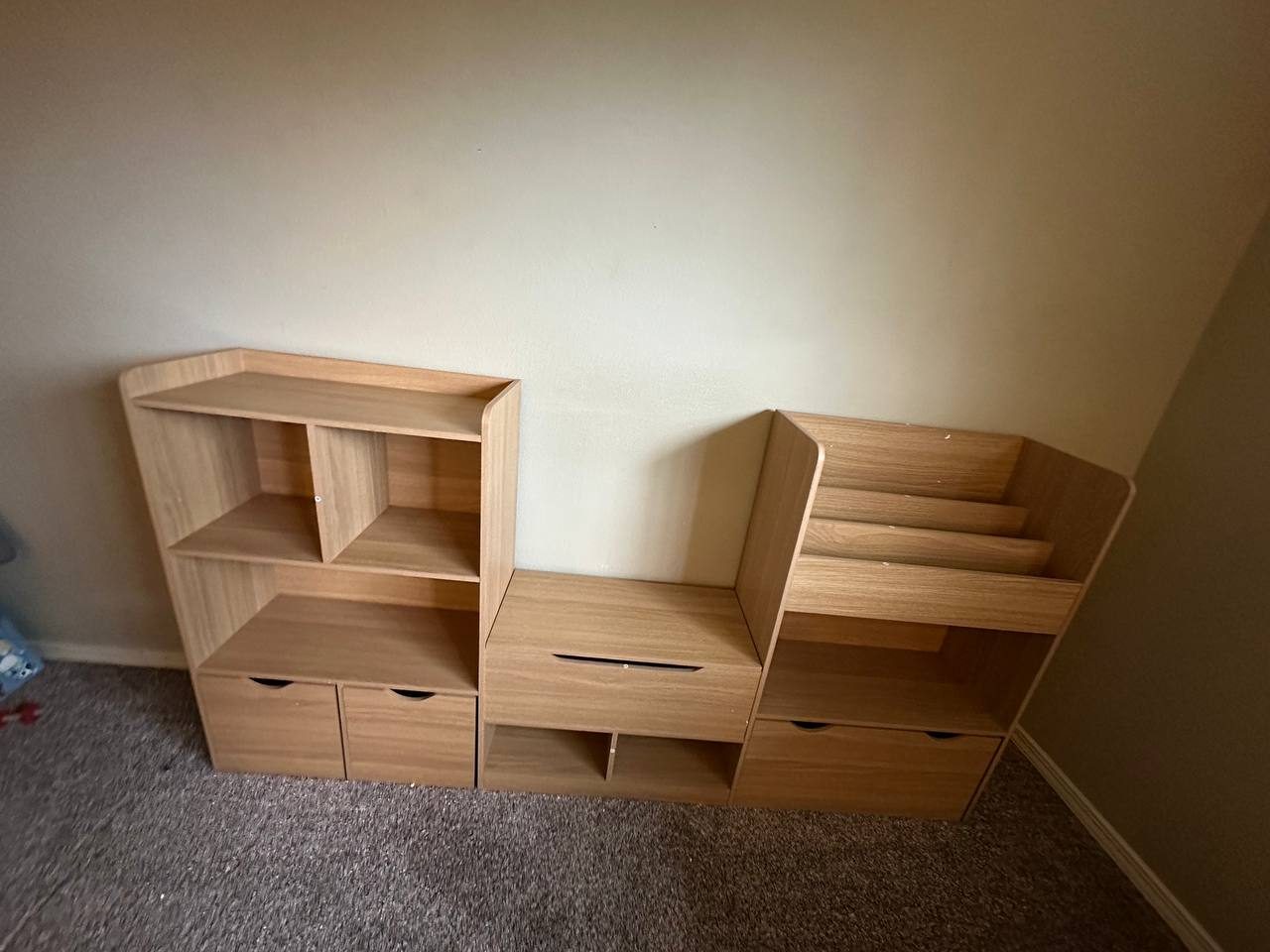 Shelving and drawer storage unit assembled and set in place