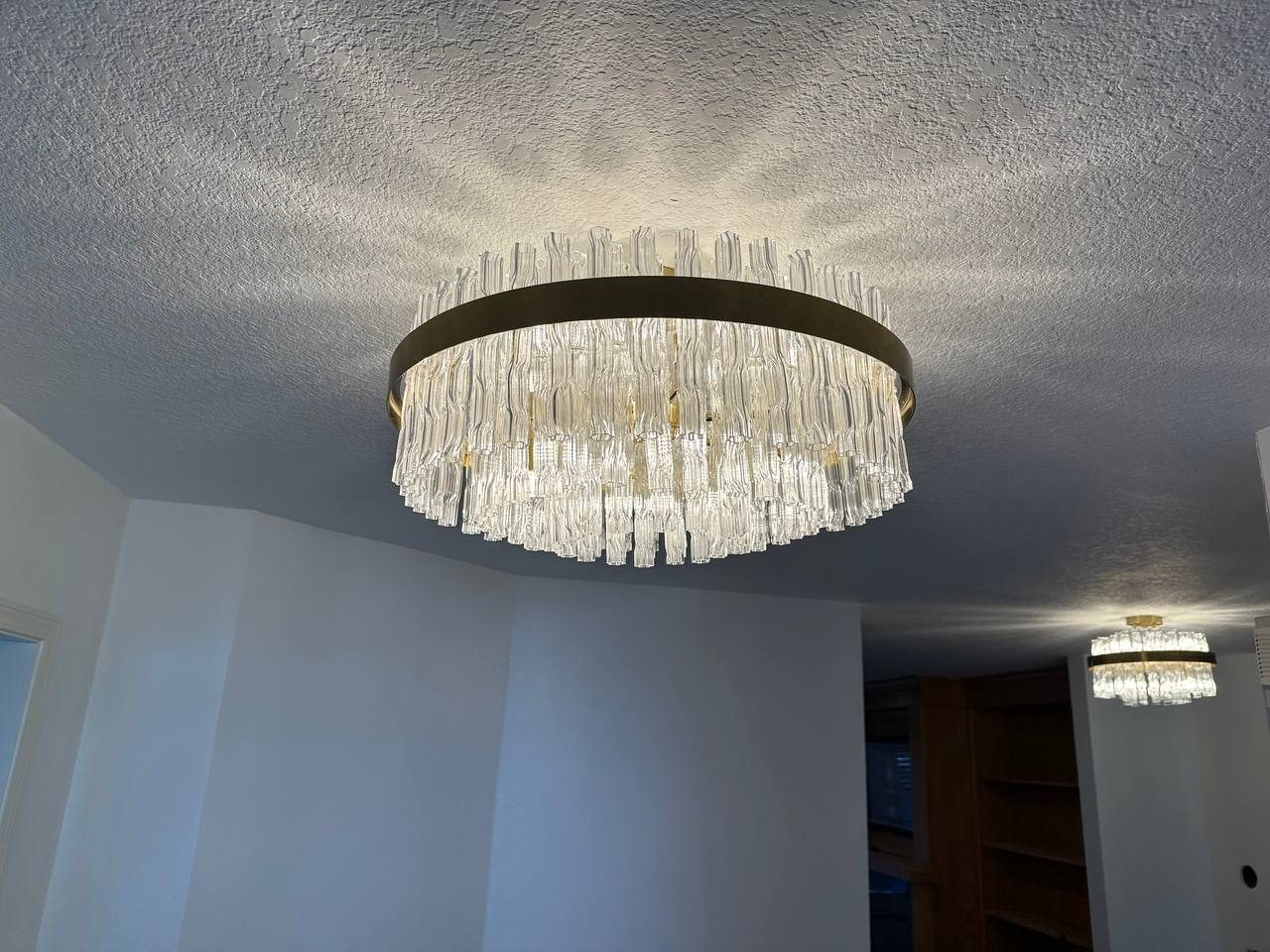 Crystal chandelier hung and wired to an existing ceiling box