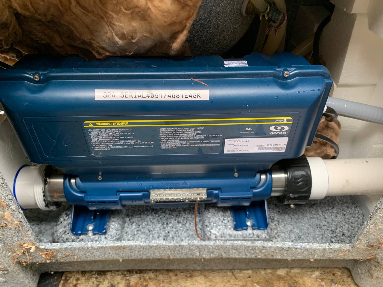 Spa control pack and heater assembly serviced inside a hot tub cabinet