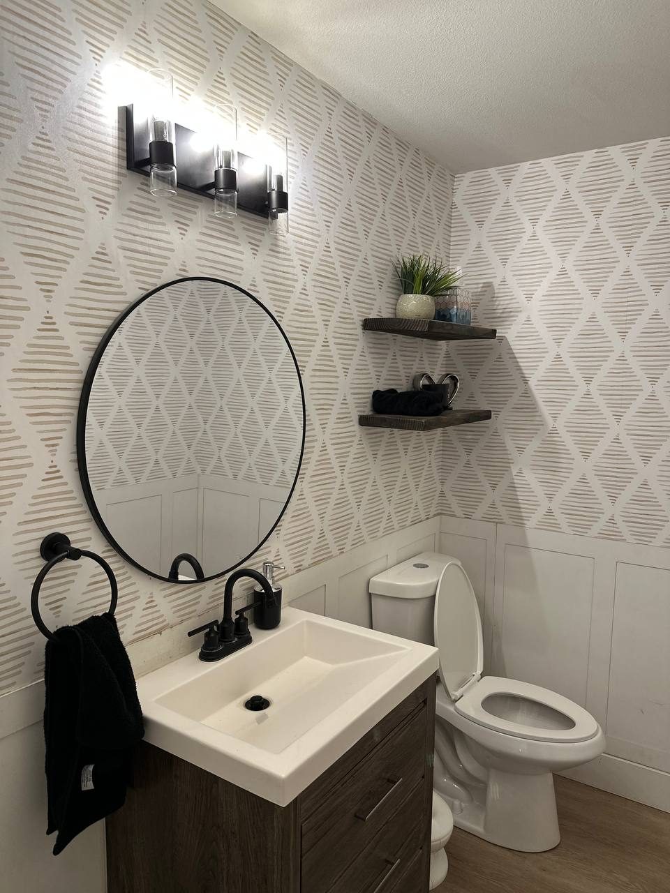 Bathroom after a new vanity, faucet, and toilet were installed